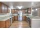 Modern kitchen with stainless steel appliances, stylish cabinetry, and granite counters at 3550 Keen Dr, Mulberry, FL 33860