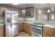 Well-equipped kitchen with stainless steel appliances and granite countertops at 3550 Keen Dr, Mulberry, FL 33860