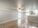 Open-concept living area with modern flooring and seamless access to kitchen at 3550 Keen Dr, Mulberry, FL 33860
