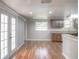 Open-concept living and kitchen area filled with natural light, perfect for modern living at 3550 Keen Dr, Mulberry, FL 33860