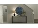 Inviting entryway featuring a modern console table and round mirror at 979 Hour Glass Rd, Lakeland, FL 33801