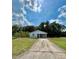 Exterior of a charming single-story home with a long driveway and carport at 1310 Payne St, Auburndale, FL 33823
