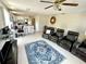 Open concept living room that leads into the kitchen and features tile flooring at 1310 Payne St, Auburndale, FL 33823