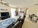 Open-concept living space with stylish furniture, connected to the kitchen and dining area at 1310 Payne St, Auburndale, FL 33823