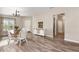 Dining room featuring wood-look floors and a decorative sideboard with sliding doors at 6050 Eagle Pointe Dr, Lakeland, FL 33812
