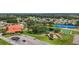 Aerial view shows clubhouse with pool, tennis courts, and bocce ball courts at 9755 Se 176Th St, Summerfield, FL 34491