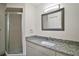 Bathroom featuring a glass shower, granite vanity, and modern fixtures at 9755 Se 176Th St, Summerfield, FL 34491