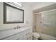 Bathroom features a vanity with granite countertop and shower-tub combo at 9755 Se 176Th St, Summerfield, FL 34491