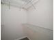 Walk-in closet featuring built-in shelving at 9755 Se 176Th St, Summerfield, FL 34491