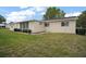 Side view of a home showing the well-manicured lawn and clean exterior at 9755 Se 176Th St, Summerfield, FL 34491