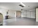 Garage features a large two car space with storage and painted flooring at 9755 Se 176Th St, Summerfield, FL 34491