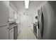 Bright kitchen featuring white cabinets, stainless steel appliances, and granite countertops at 9755 Se 176Th St, Summerfield, FL 34491