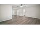 Open living area with stylish flooring, ceiling fan, and access to other rooms at 9755 Se 176Th St, Summerfield, FL 34491