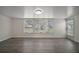 Bright living room featuring modern floors, and multiple windows for natural light at 9755 Se 176Th St, Summerfield, FL 34491