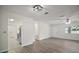 Inviting living space with hardwood-style floors and an open layout leading to the kitchen at 9755 Se 176Th St, Summerfield, FL 34491