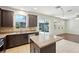 Stylish kitchen showcasing granite countertops, ample cabinet space, and outdoor access at 3848 Spirited Cir, St Cloud, FL 34772