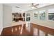 Open living space featuring hardwood floors, natural light, and a view into the kitchen at 3848 Spirited Cir, St Cloud, FL 34772