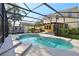 Backyard with sparkling pool, an outdoor kitchen, and screened-in enclosure for relaxation and entertainment at 3848 Spirited Cir, St Cloud, FL 34772
