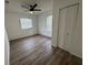 Inviting bedroom with natural light from two windows, a ceiling fan, and a double door closet at 45652 Ohio St, Paisley, FL 32767