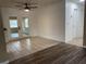 Dining area with tile flooring, glass patio doors to the living room, and natural light at 45652 Ohio St, Paisley, FL 32767
