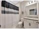Bathroom featuring granite countertops, modern vanity with white cabinets, and unique shower curtain at 1803 Daybreak Dr, Fruitland Park, FL 34731