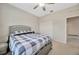 Bedroom with ceiling fan and ensuite bathroom at 1803 Daybreak Dr, Fruitland Park, FL 34731