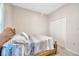 Bedroom with a wooden bed frame and a large closet at 1803 Daybreak Dr, Fruitland Park, FL 34731