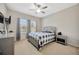 Bedroom with ceiling fan, and two large windows that provide natural light at 1803 Daybreak Dr, Fruitland Park, FL 34731