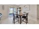 Dining area with a wooden table, chairs, and a sliding glass door leading to the outdoors at 1803 Daybreak Dr, Fruitland Park, FL 34731