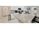 Well-equipped kitchen with granite countertops, stainless steel appliances, and white cabinetry at 1803 Daybreak Dr, Fruitland Park, FL 34731