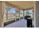 Comfortable screened porch offering an inviting outdoor living space at 1803 Daybreak Dr, Fruitland Park, FL 34731
