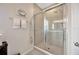 Modern glass shower with upgraded tile, and a double shower head at 1803 Daybreak Dr, Fruitland Park, FL 34731