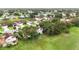 Expansive aerial view of a residential area surrounded by a golf course and mature trees at 2524 Albion Ave, Orlando, FL 32833