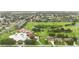 Scenic aerial view showcasing a golf course with residential properties in a suburban neighborhood at 2524 Albion Ave, Orlando, FL 32833