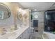 The bathroom boasts double sinks, modern fixtures, and a walk-in shower at 2524 Albion Ave, Orlando, FL 32833