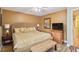 Warm bedroom featuring a wicker bed with a decorative bench and natural lighting at 2524 Albion Ave, Orlando, FL 32833
