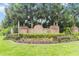 Wedgefield community sign with palm trees and manicured landscaping at the entrance at 2524 Albion Ave, Orlando, FL 32833