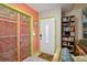 Entryway with colorful walls, decorative closet doors, and a tiled floor at 2524 Albion Ave, Orlando, FL 32833