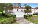 Beautiful two-story home with a two-car garage, lush landscaping, and a well-manicured lawn at 2524 Albion Ave, Orlando, FL 32833