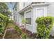 This townhouse features updated gutters and landscaping around the front entrance at 2524 Albion Ave, Orlando, FL 32833