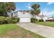 Two story home featuring a driveway leading to a two car garage at 2524 Albion Ave, Orlando, FL 32833