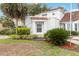 Home featuring green landscaping, a red tile roof, and white stucco at 2524 Albion Ave, Orlando, FL 32833