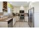 Functional kitchen featuring a stainless steel oven, dishwasher, and ample storage space at 2524 Albion Ave, Orlando, FL 32833