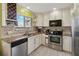 Well-equipped kitchen with stainless steel appliances, granite countertops, and ample cabinet space at 2524 Albion Ave, Orlando, FL 32833