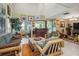 Living room features a high ceiling, bamboo furniture, and tile floors at 2524 Albion Ave, Orlando, FL 32833