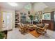 Open living room with tile floors, bamboo furniture, and bright, natural light at 2524 Albion Ave, Orlando, FL 32833