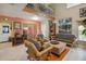 Open living room with colorful walls, bamboo furniture, and a second floor overlook at 2524 Albion Ave, Orlando, FL 32833