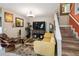 Inviting living room with stylish furniture, wooden staircase, and plenty of natural light at 2524 Albion Ave, Orlando, FL 32833