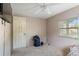 Cozy bedroom with ceiling fan and window with blinds at 1224 S Delaware Ave, Deland, FL 32720