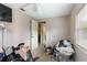 Bedroom with a ceiling fan and door to hallway at 1224 S Delaware Ave, Deland, FL 32720